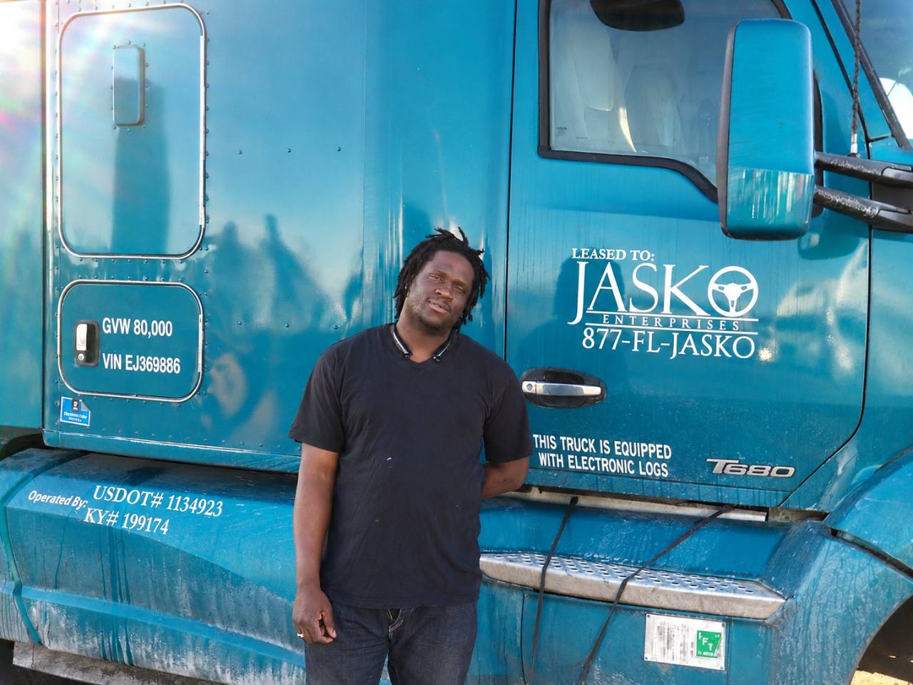 Glenn Hyppolite beside his JASKO tractor