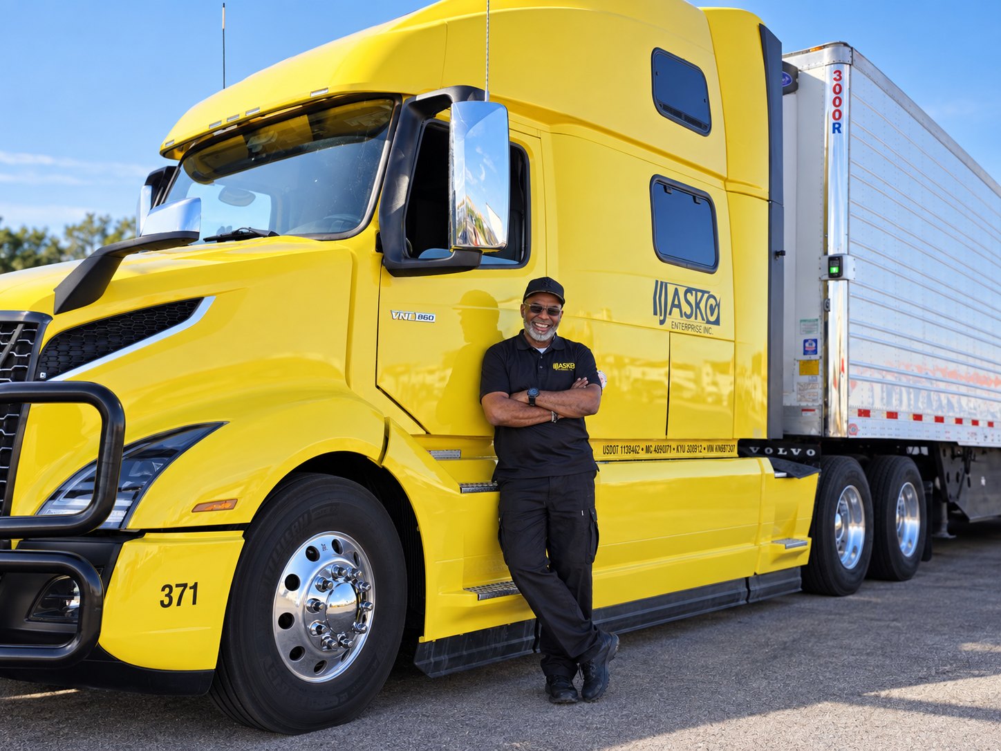 John Thomas beside a yellow JASKO tractor