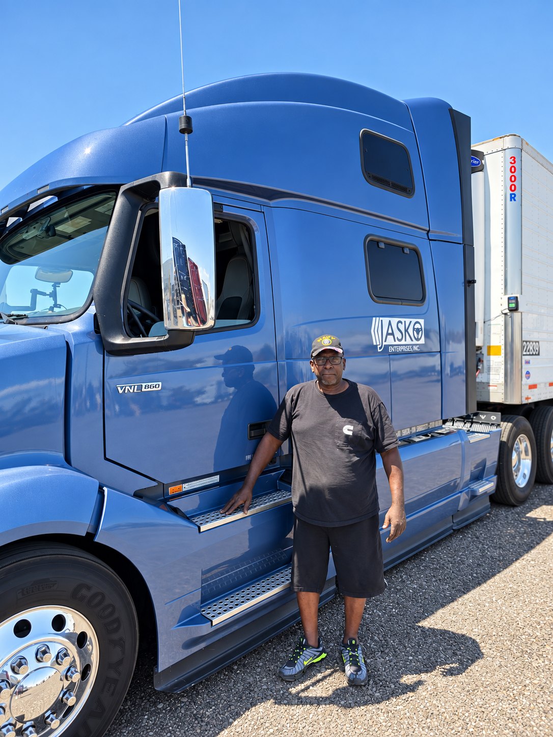 Lonnie Adams beside blue JASKO tractor 373