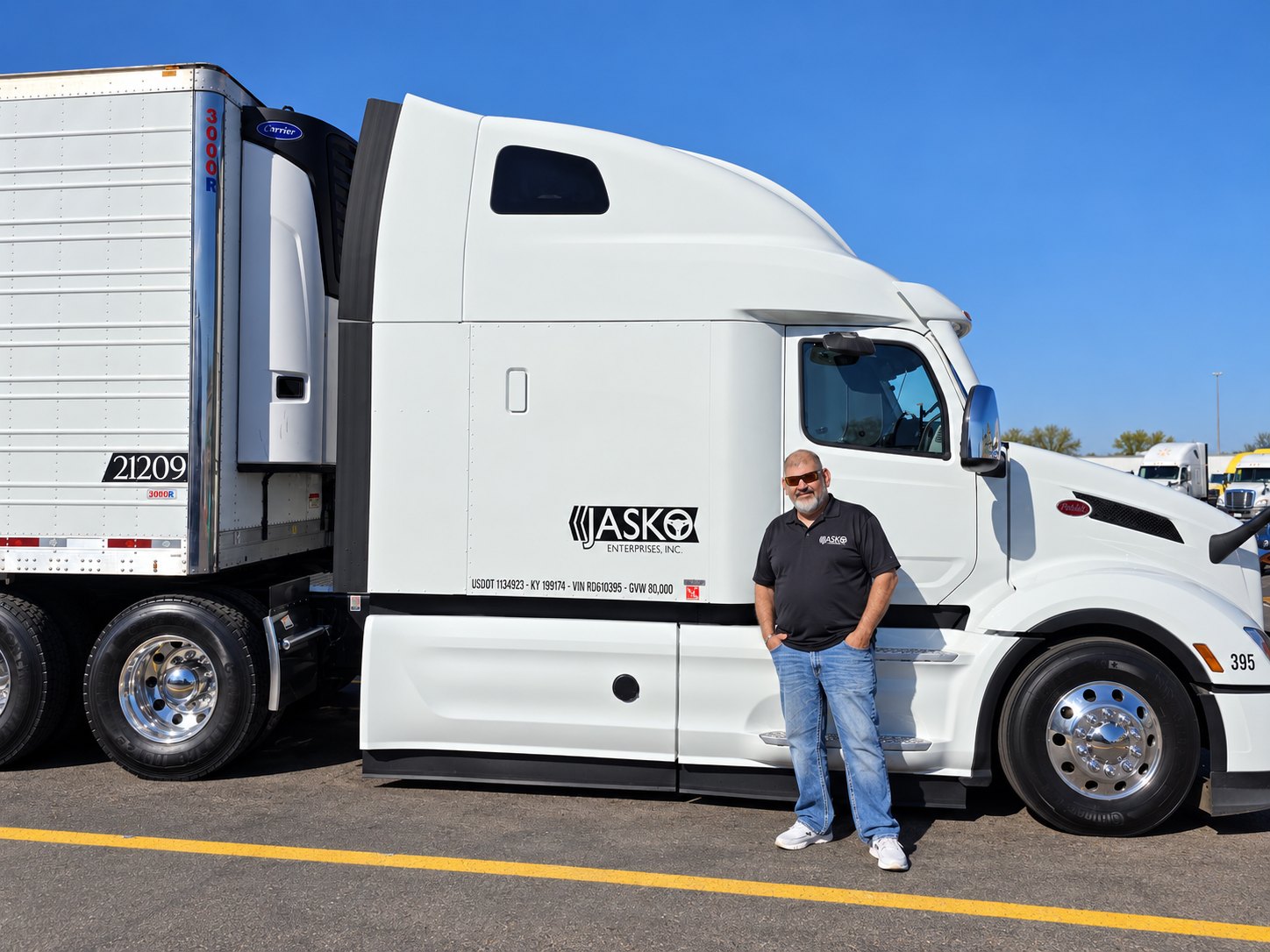Raul Torrez beside white JASKO tractor 395